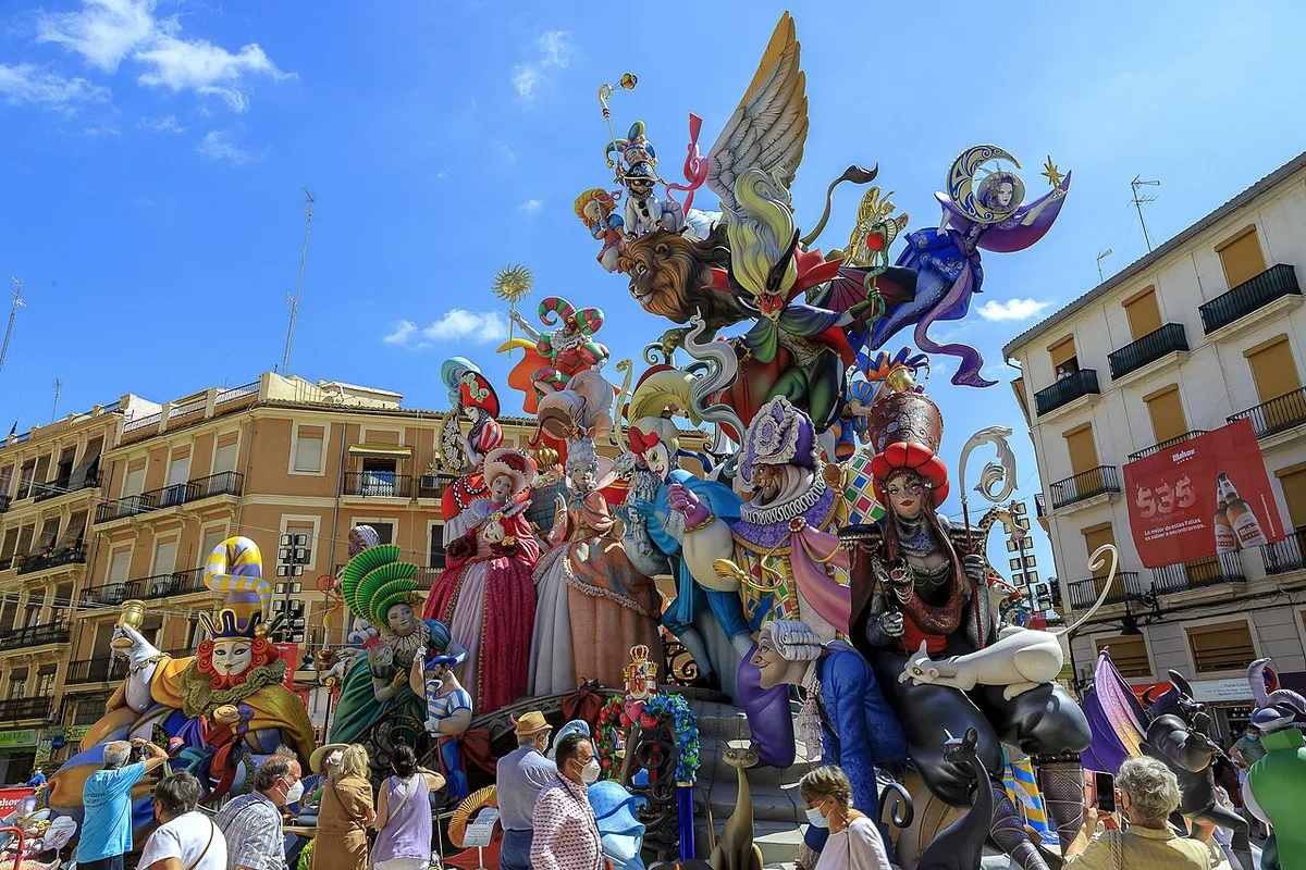 A towering painted Fallas monument in a Valencia square before the burning — 1
